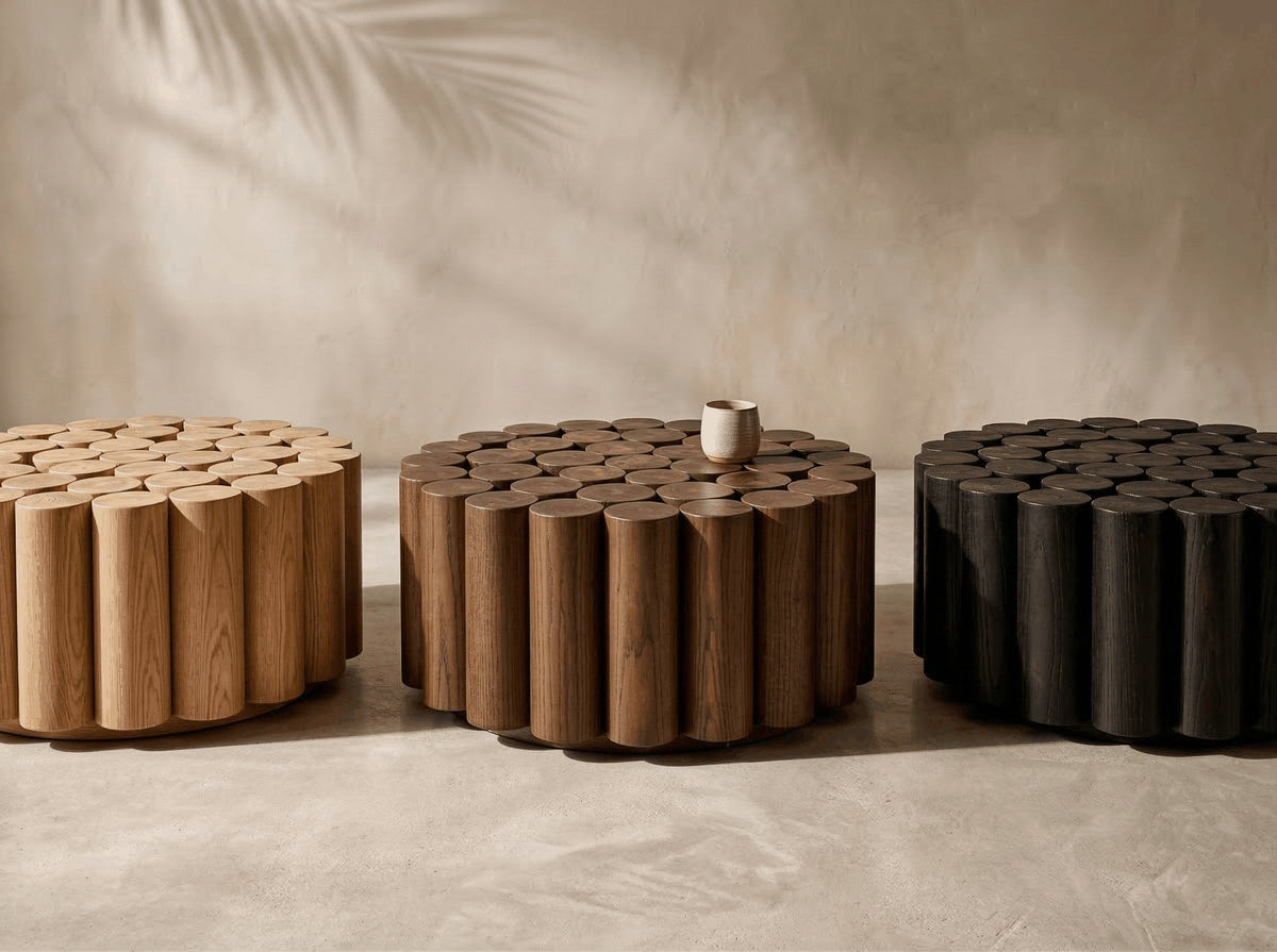 Three sculptural solid wood coffee tables in natural, walnut and charcoal